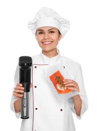 Photo of Chef holding sous vide cooker and salmon in vacuum pack on white background