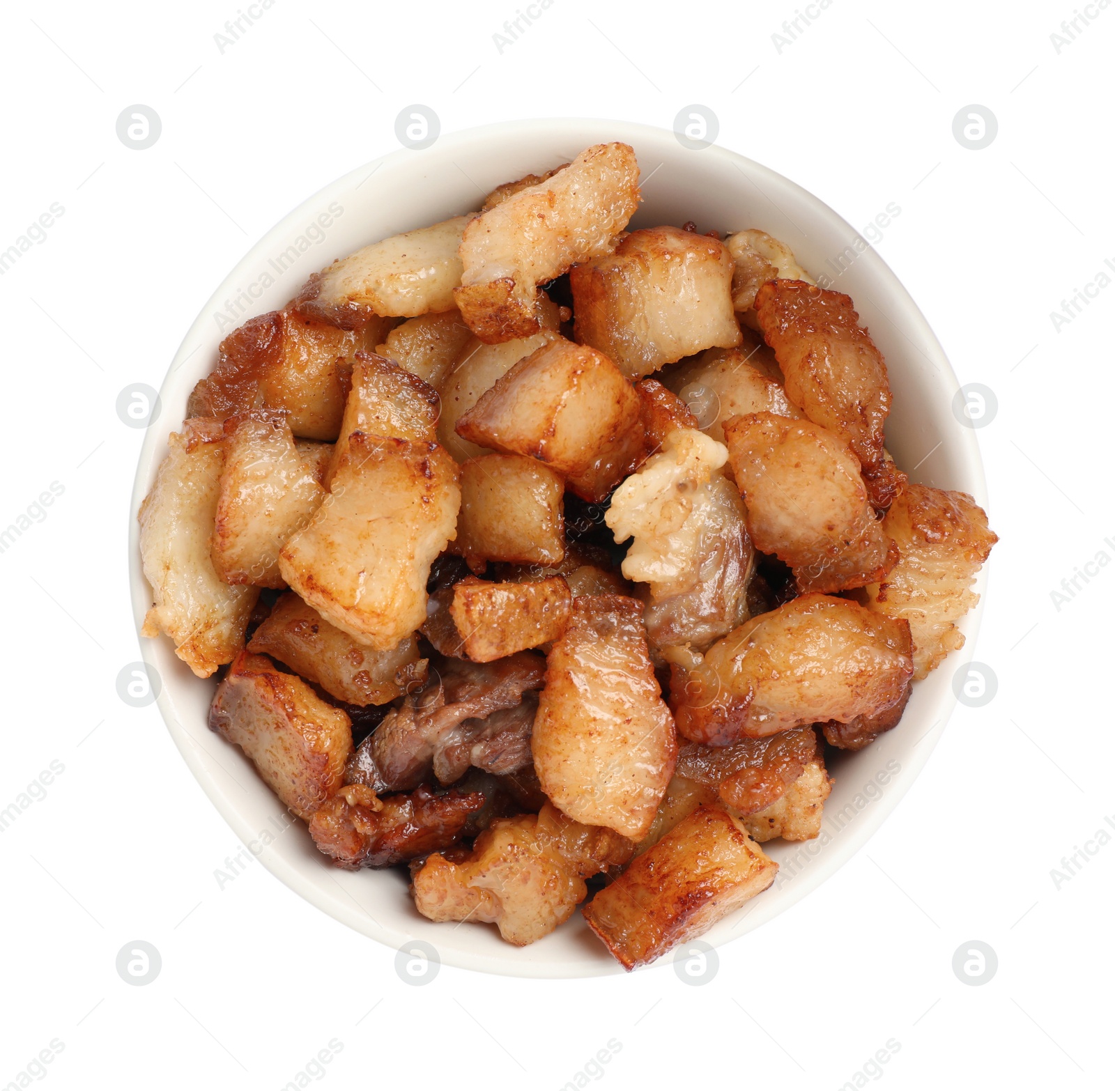 Photo of Tasty fried cracklings in bowl on white background, top view. Cooked pork lard