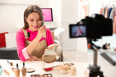 Photo of Beauty blogger filming make up tutorial at home