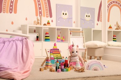 Photo of Many different toys on floor in child's room