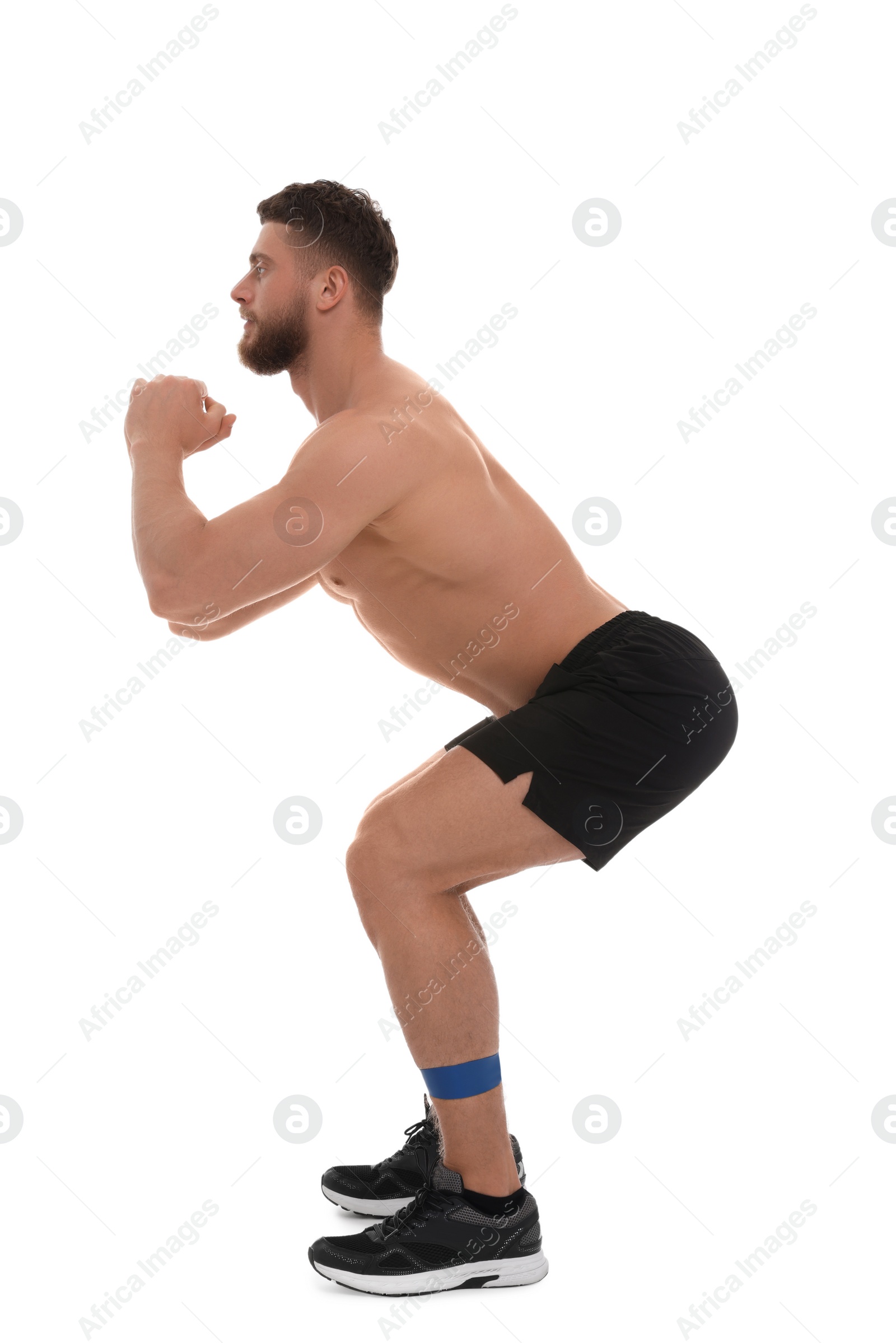 Photo of Young man exercising with elastic resistance band on white background