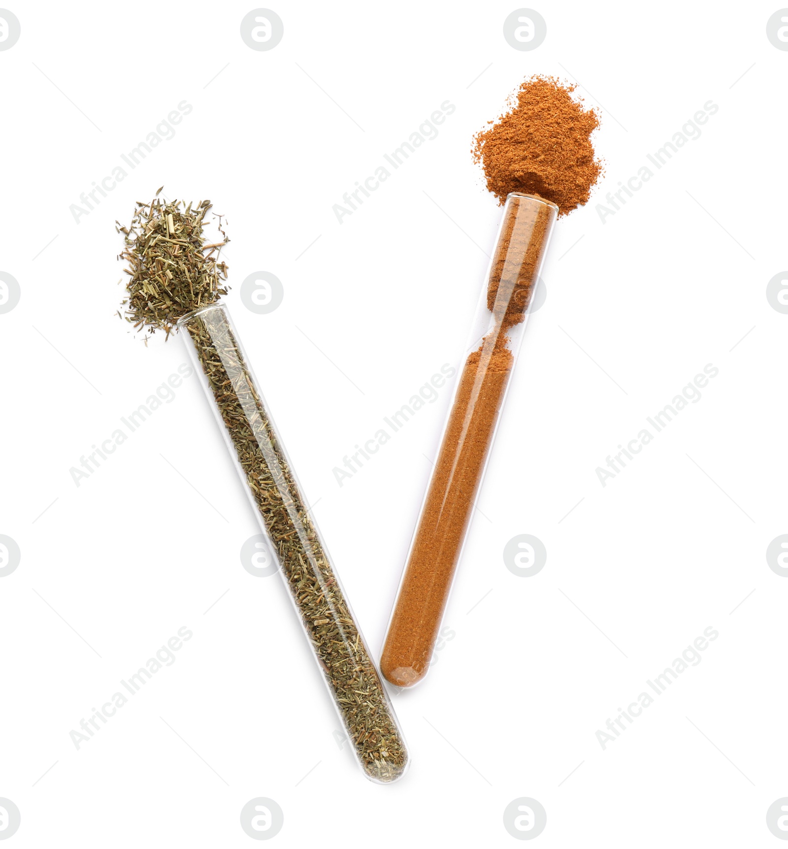 Photo of Glass tubes with Italian herb mix and ground red pepper on white background, top view