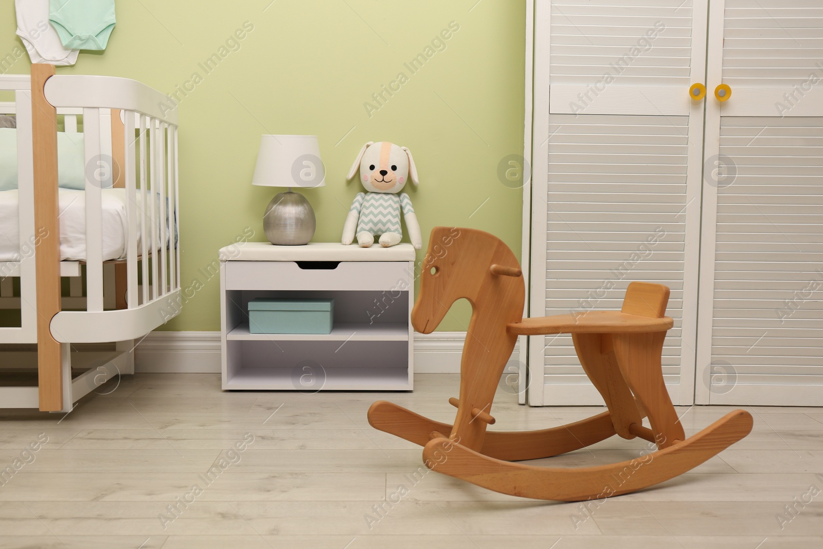 Photo of Baby room interior with stylish furniture and toys