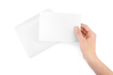 Photo of Woman holding blank letter on white background, top view