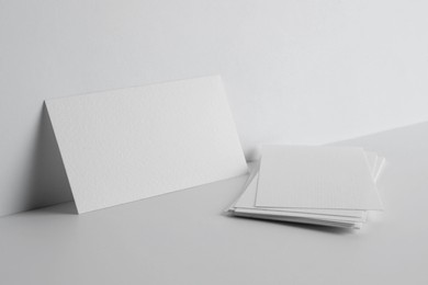 Photo of Blank business cards on white background. Mockup for design