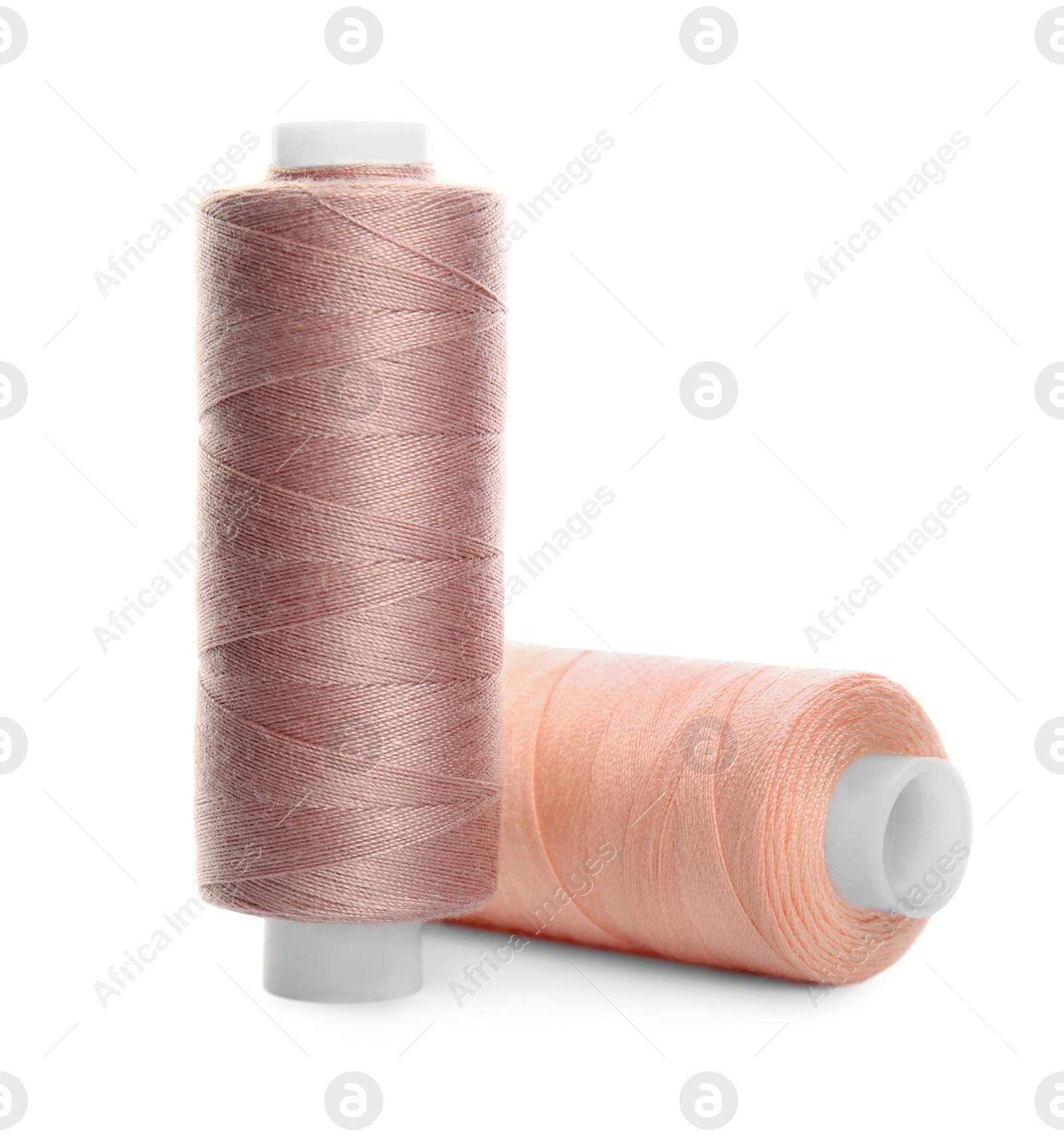 Photo of Different colorful sewing threads on white background