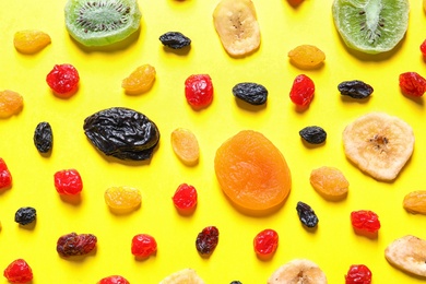 Photo of Flat lay composition with different dried fruits on color background. Healthy lifestyle