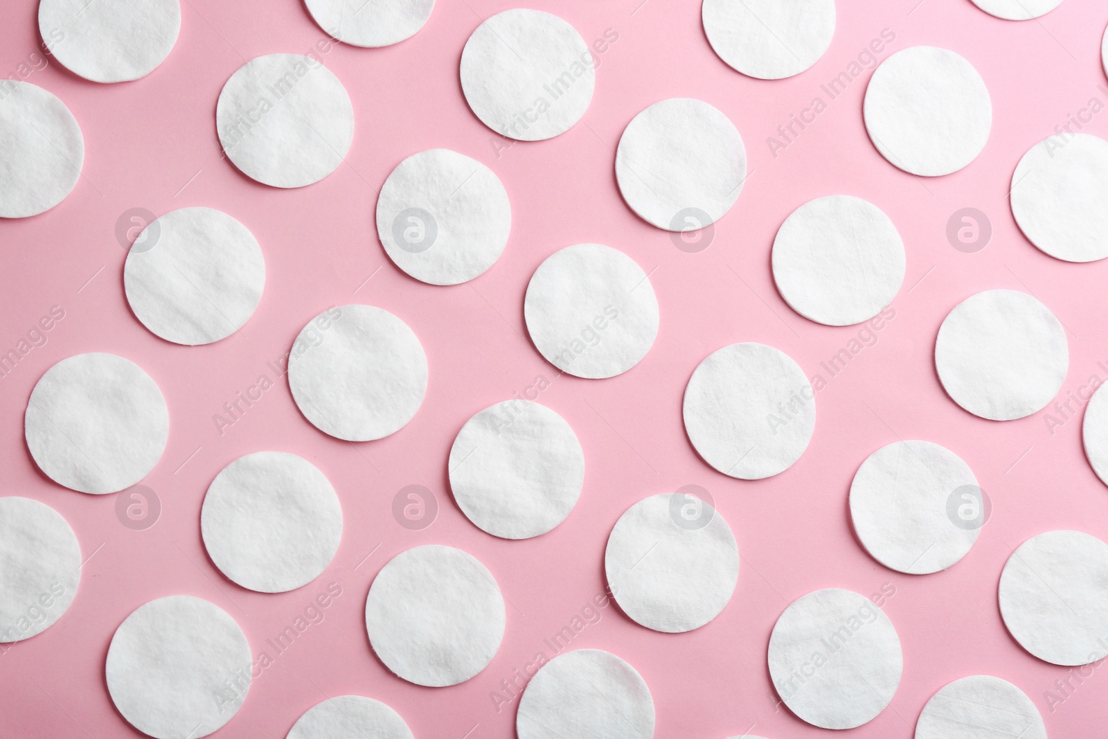 Photo of Flat lay composition with cotton pads on color background