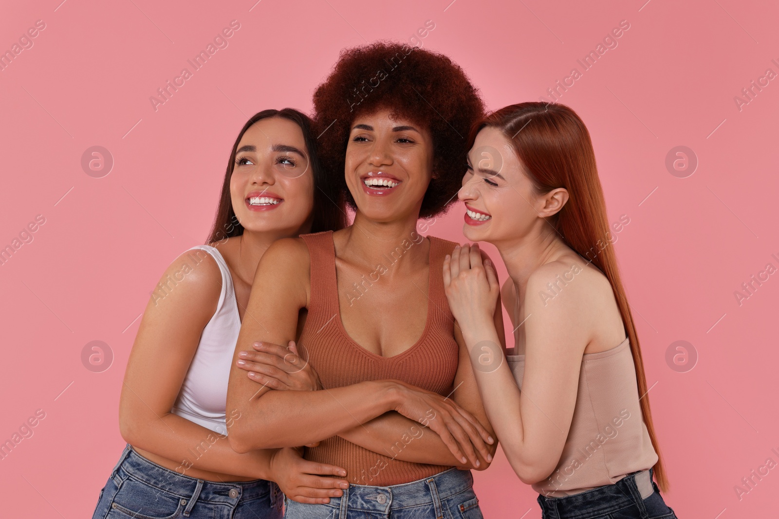 Photo of Portrait of beautiful young women on pink background