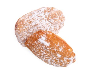 Delicious homemade madeleine cakes with powdered sugar on white background, top view