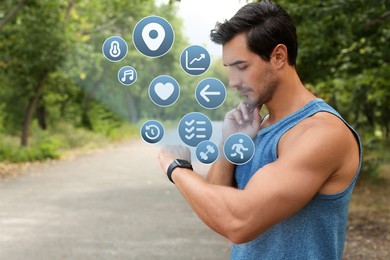 Image of Young man checking fitness tracker after training in park
