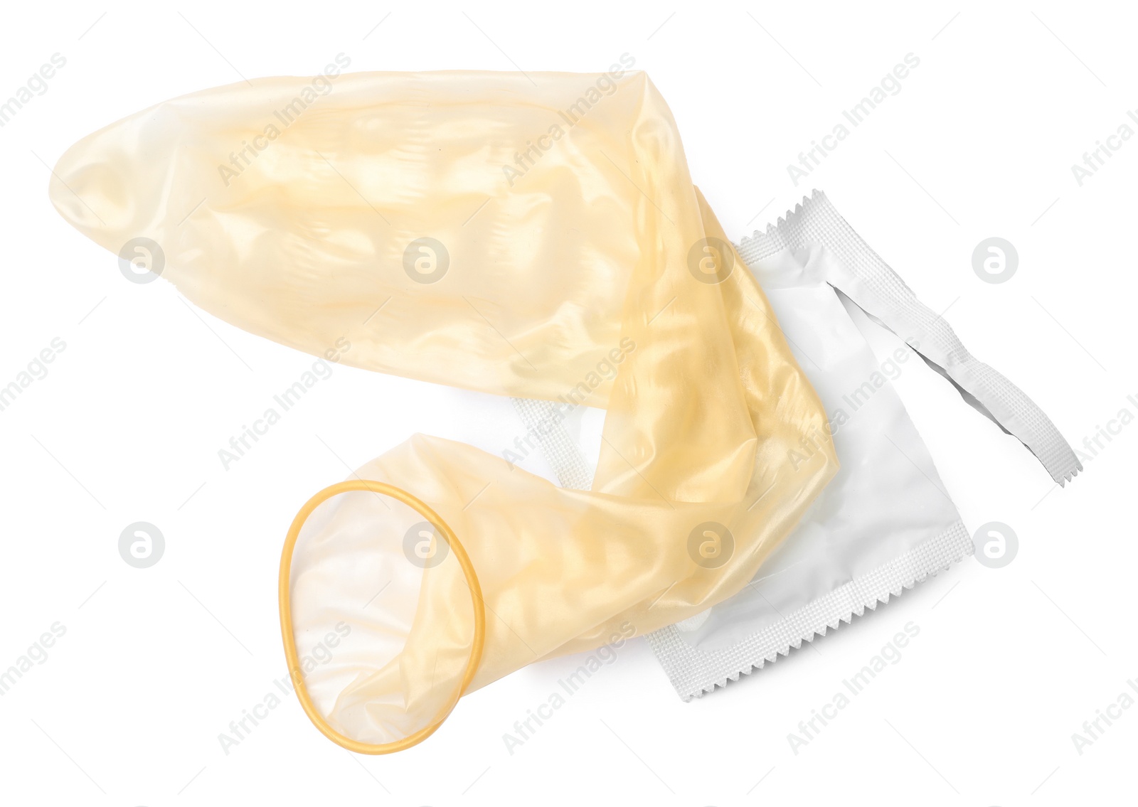 Image of Unrolled condom and package on white background, top view. Safe sex