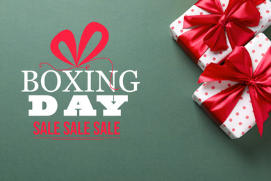 Text Boxing Day Sale and gift on color background, top view