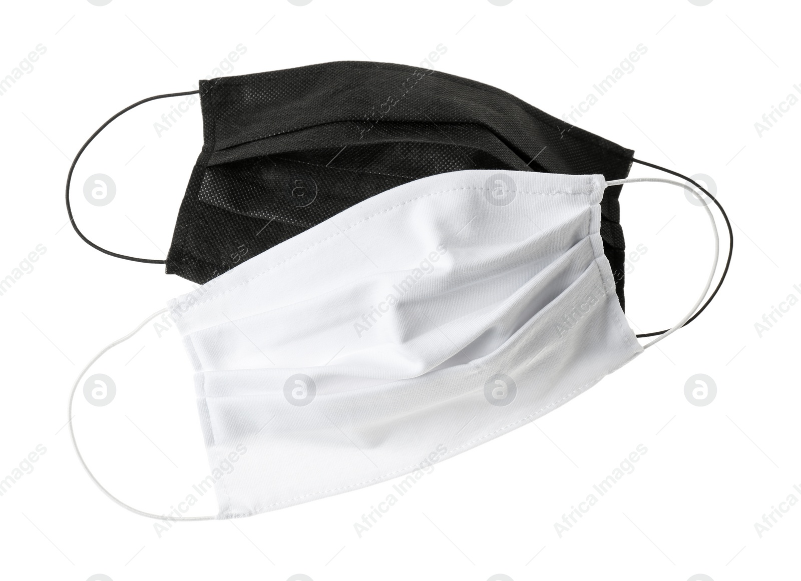 Photo of Homemade protective face masks isolated on white, top view