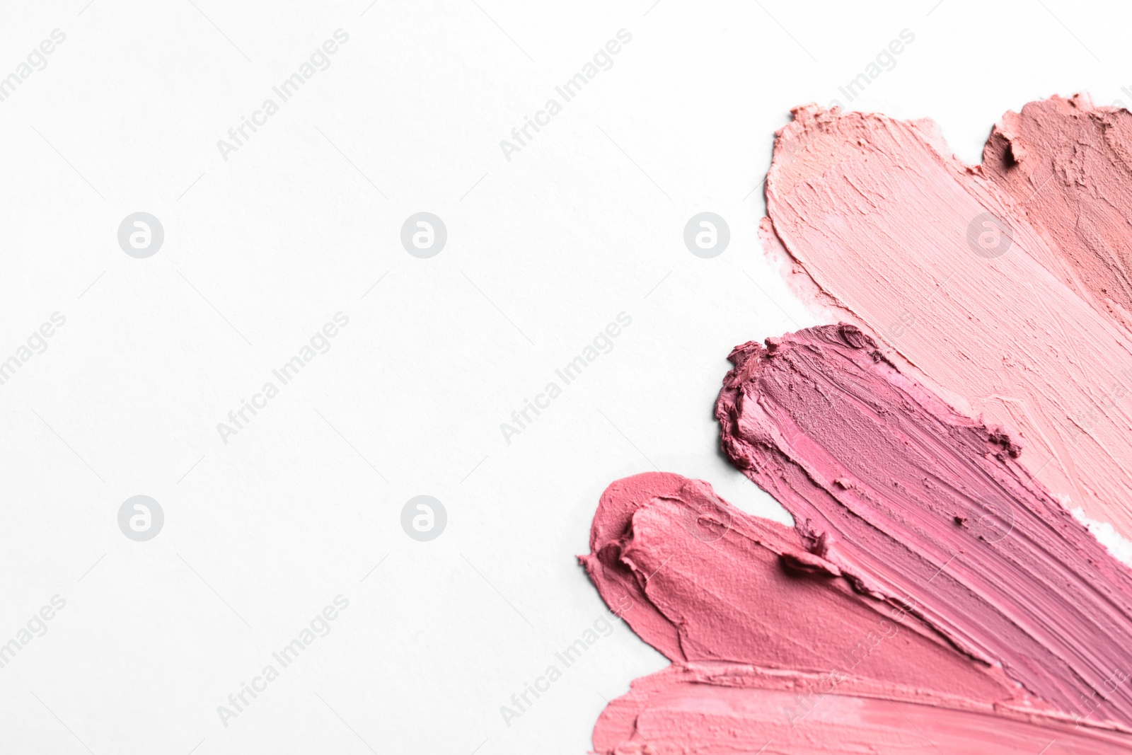 Photo of Lipstick smears isolated on white, top view. Space for text