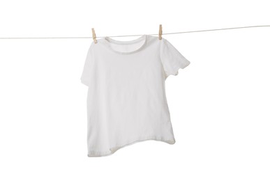 One t-shirt drying on washing line isolated on white