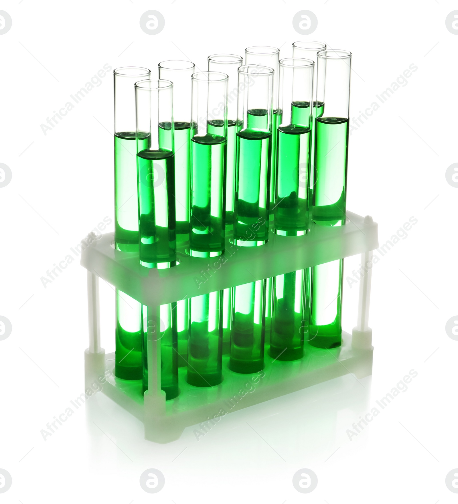 Photo of Test tubes with green liquid on white background