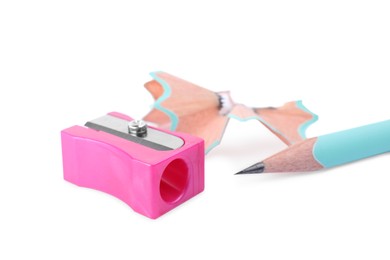 Pink sharpener with shavings and pencil on white background