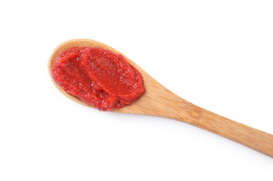 Wooden spoon of tasty tomato paste isolated on white, top view