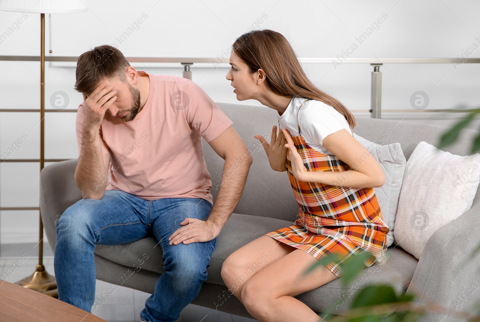 Photo of Couple having quarrel at home. Relationship problems