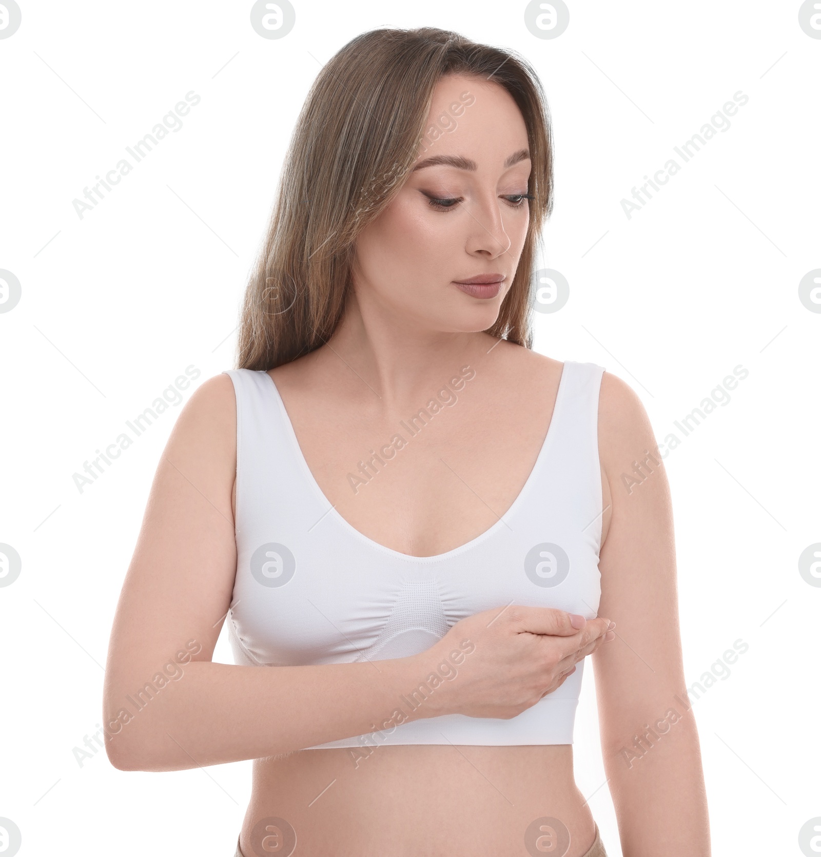 Photo of Mammology. Young woman doing breast self-examination on white background