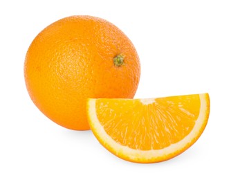 Photo of Whole and cut fresh oranges isolated on white