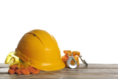 Photo of Set of safety equipment on table against white background