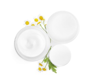 Photo of Body cream and other cosmetic products with camomile on white background, top view