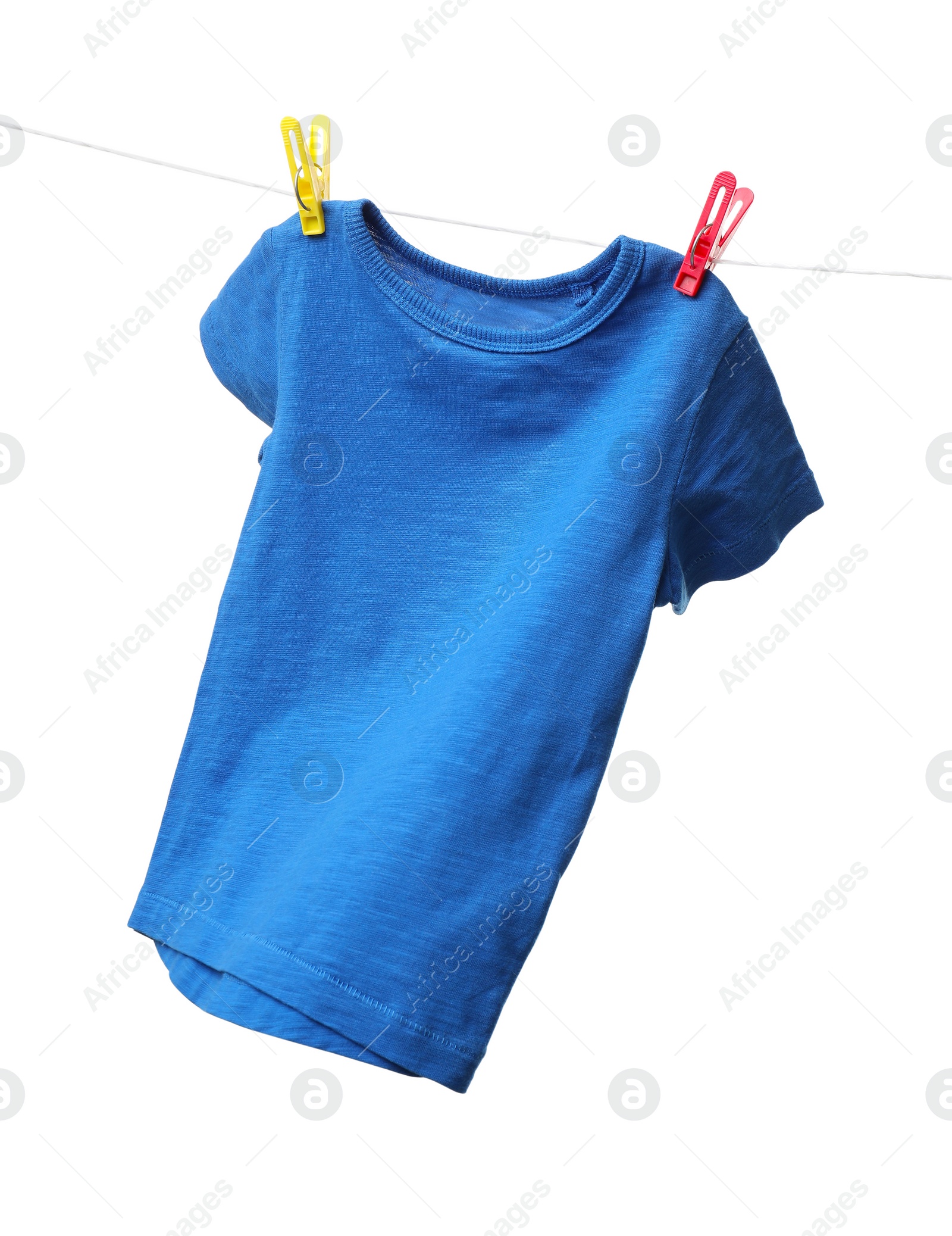 Photo of One blue t-shirt drying on washing line isolated on white