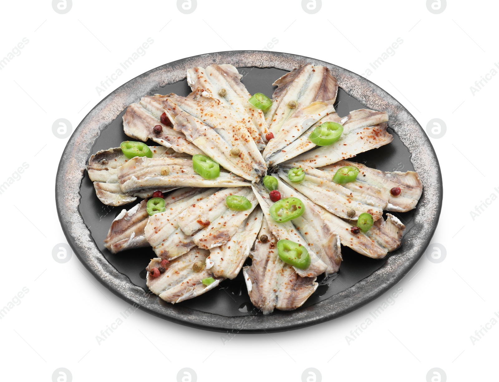 Photo of Tasty pickled anchovies with spices isolated on white