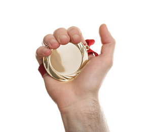 Man holding golden medal on white background, closeup. Space for design