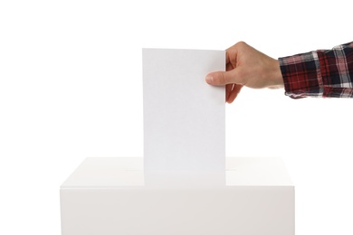 Photo of Man putting his vote into ballot box on white background, closeup