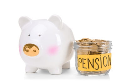 Piggy bank, glass jar with label "PENSION" and coins on white background