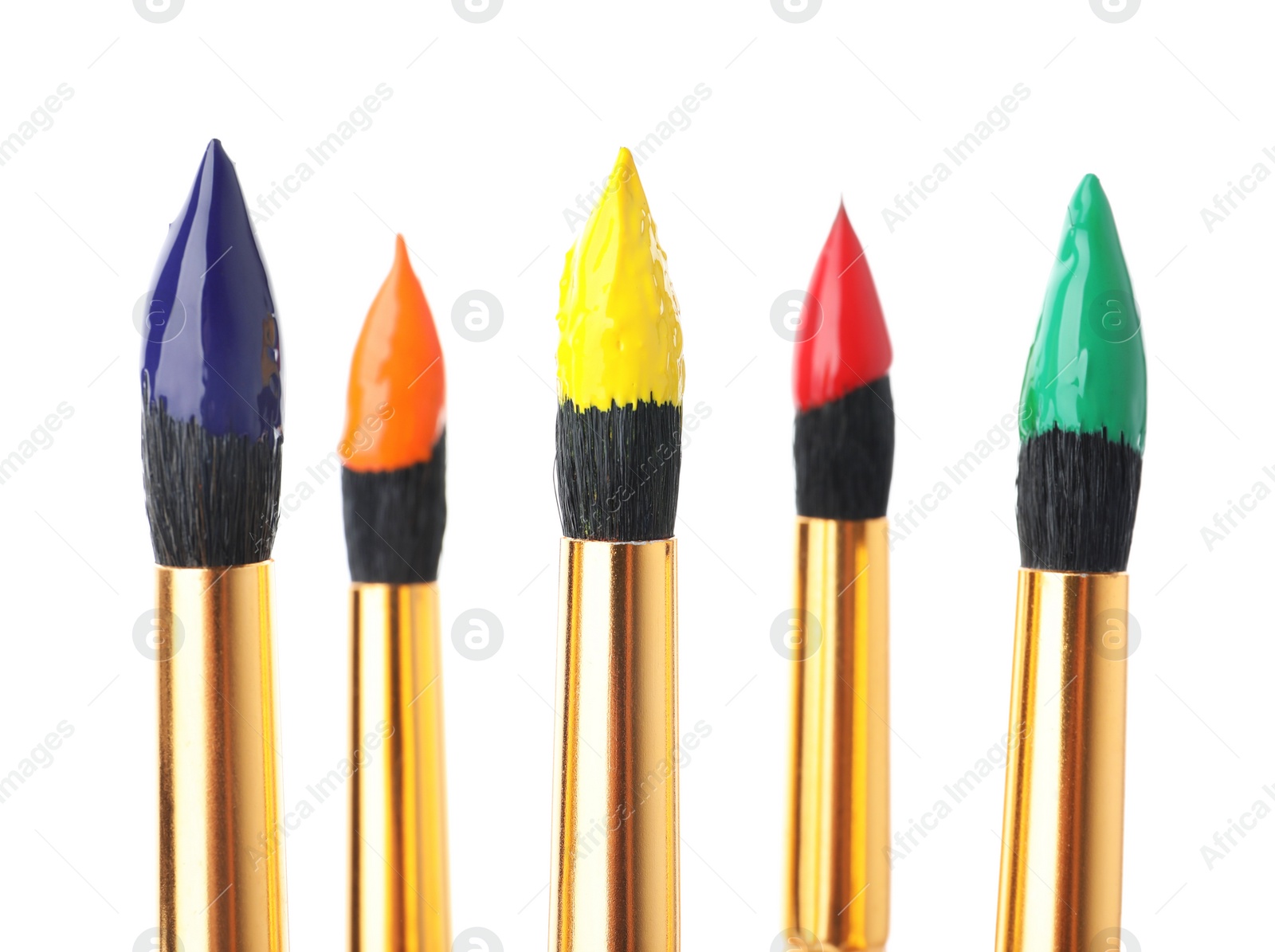 Photo of Brushes with colorful paints on white background