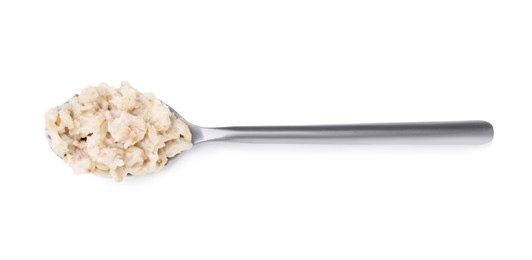 Spoon with oatmeal isolated on white, top view