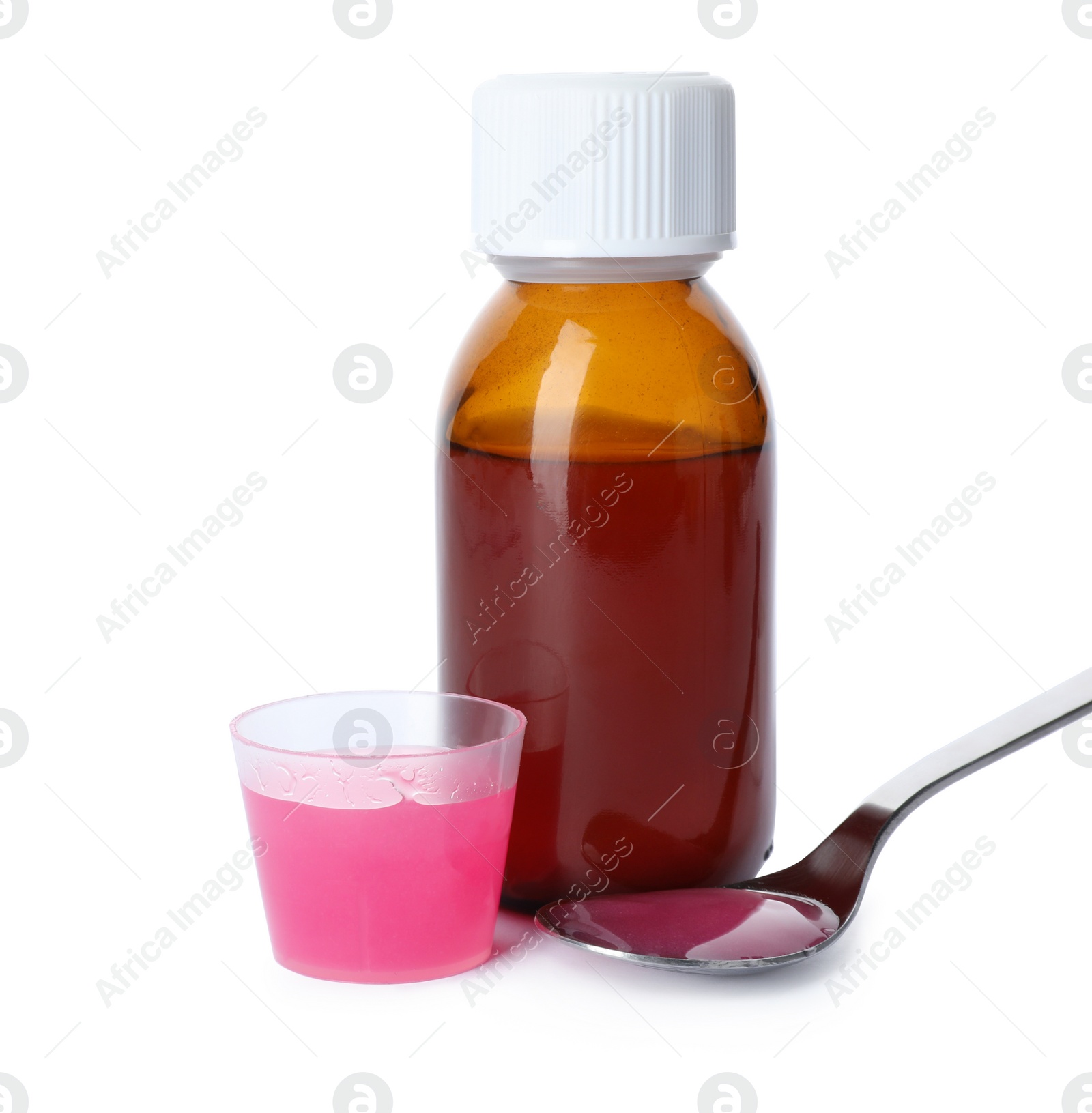Photo of Spoon, measuring cup and bottle of cough syrup on white background
