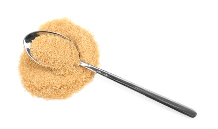 Pile of brown sugar and spoon isolated on white, top view