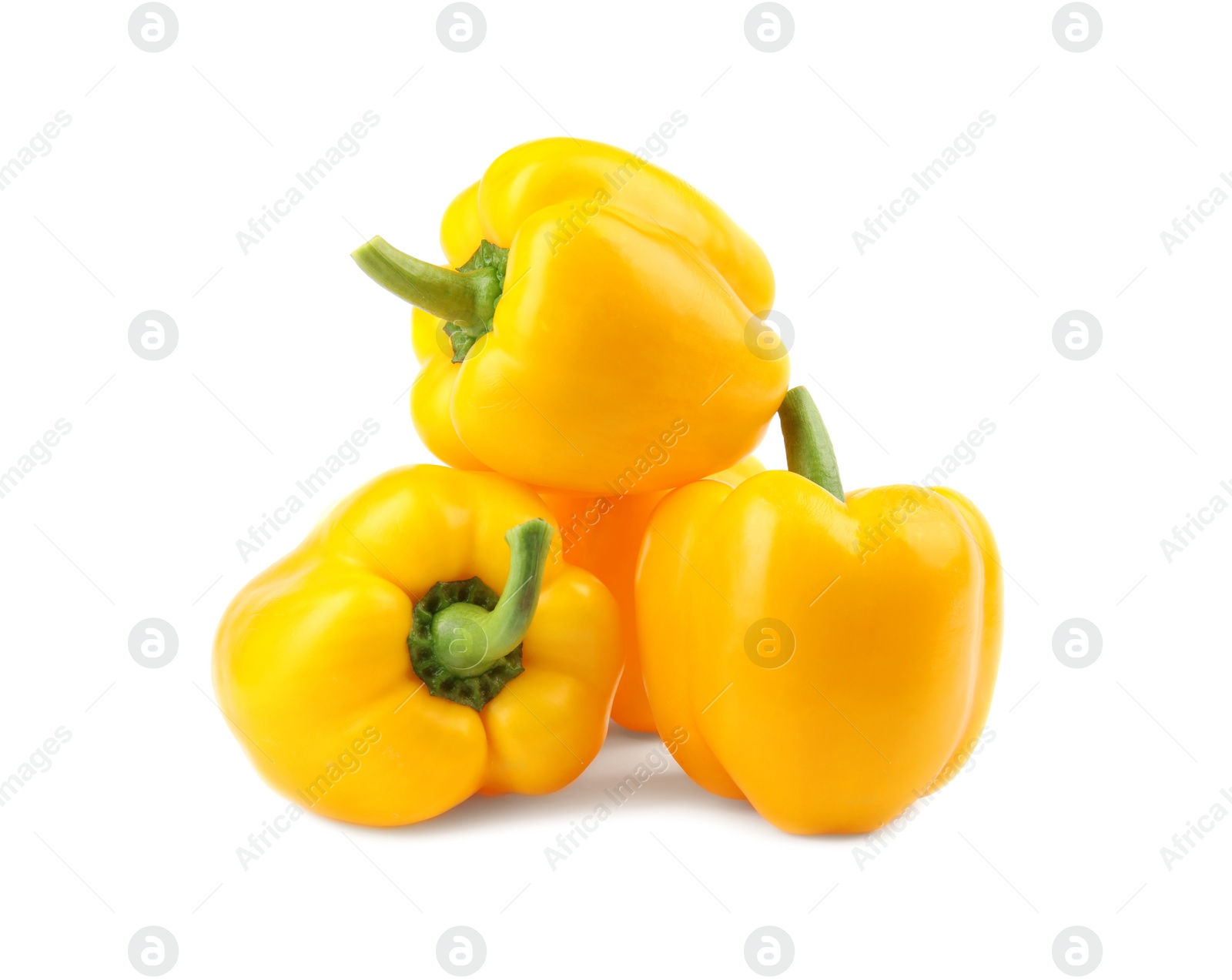 Photo of Ripe yellow bell peppers isolated on white