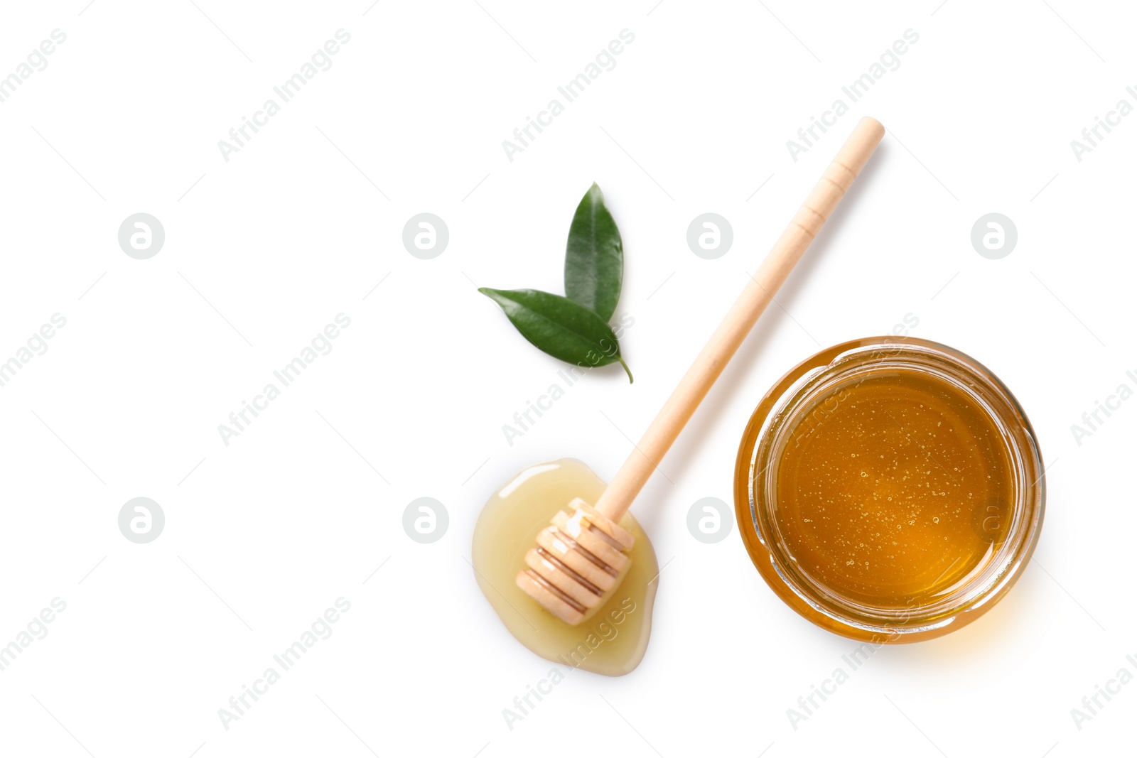 Photo of Tasty honey in glass jar, leaves and dipper on white background, flat lay. Space for text