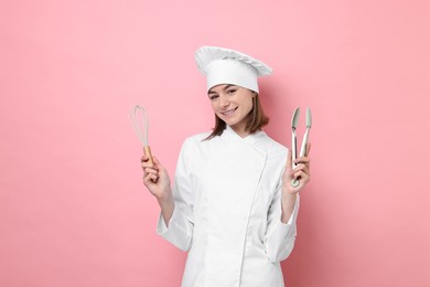 Photo of Professional chef with tongs and whisk on pink background