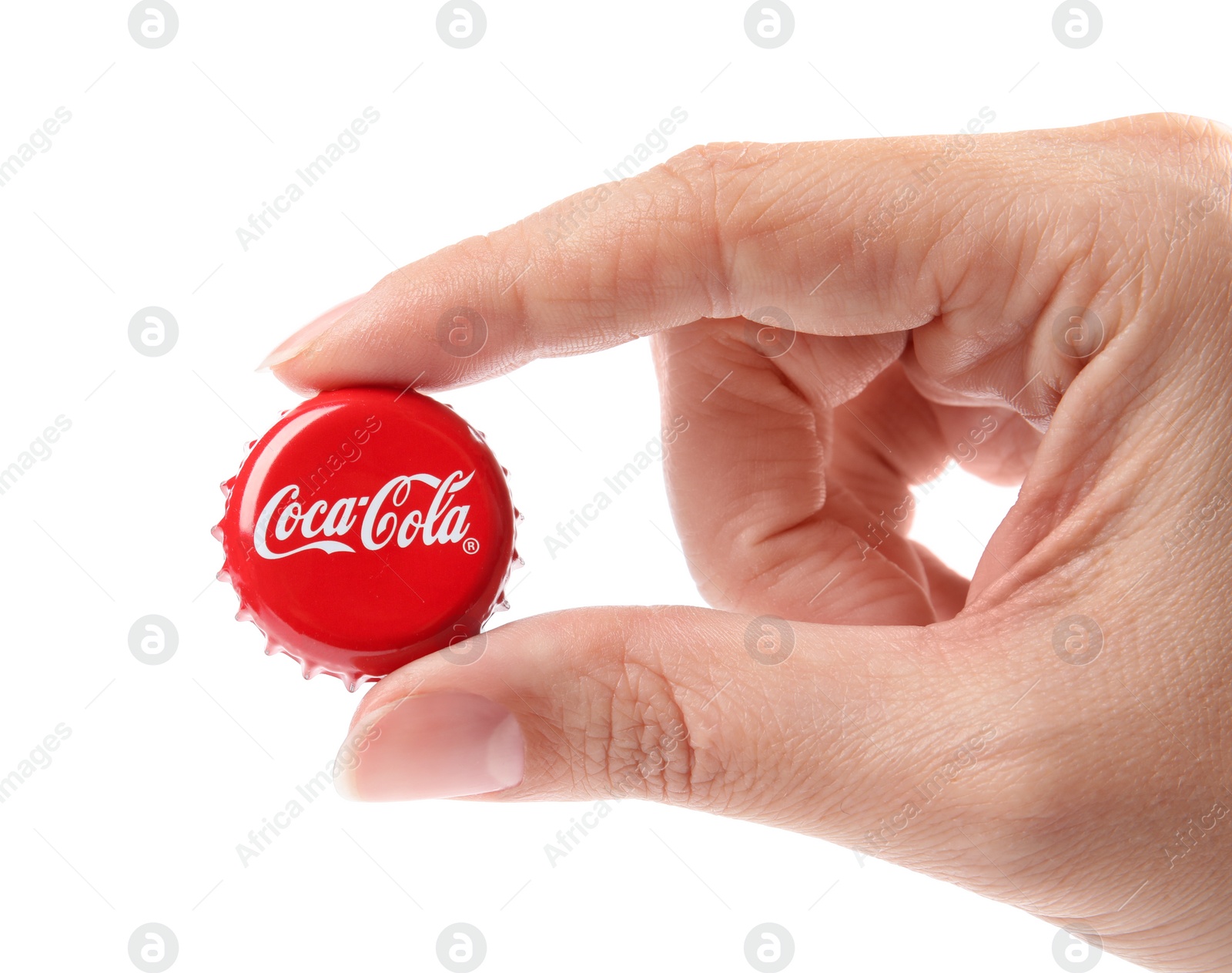 Photo of MYKOLAIV, UKRAINE - NOVEMBER 15, 2018: Woman holding Coca Cola lid on white background