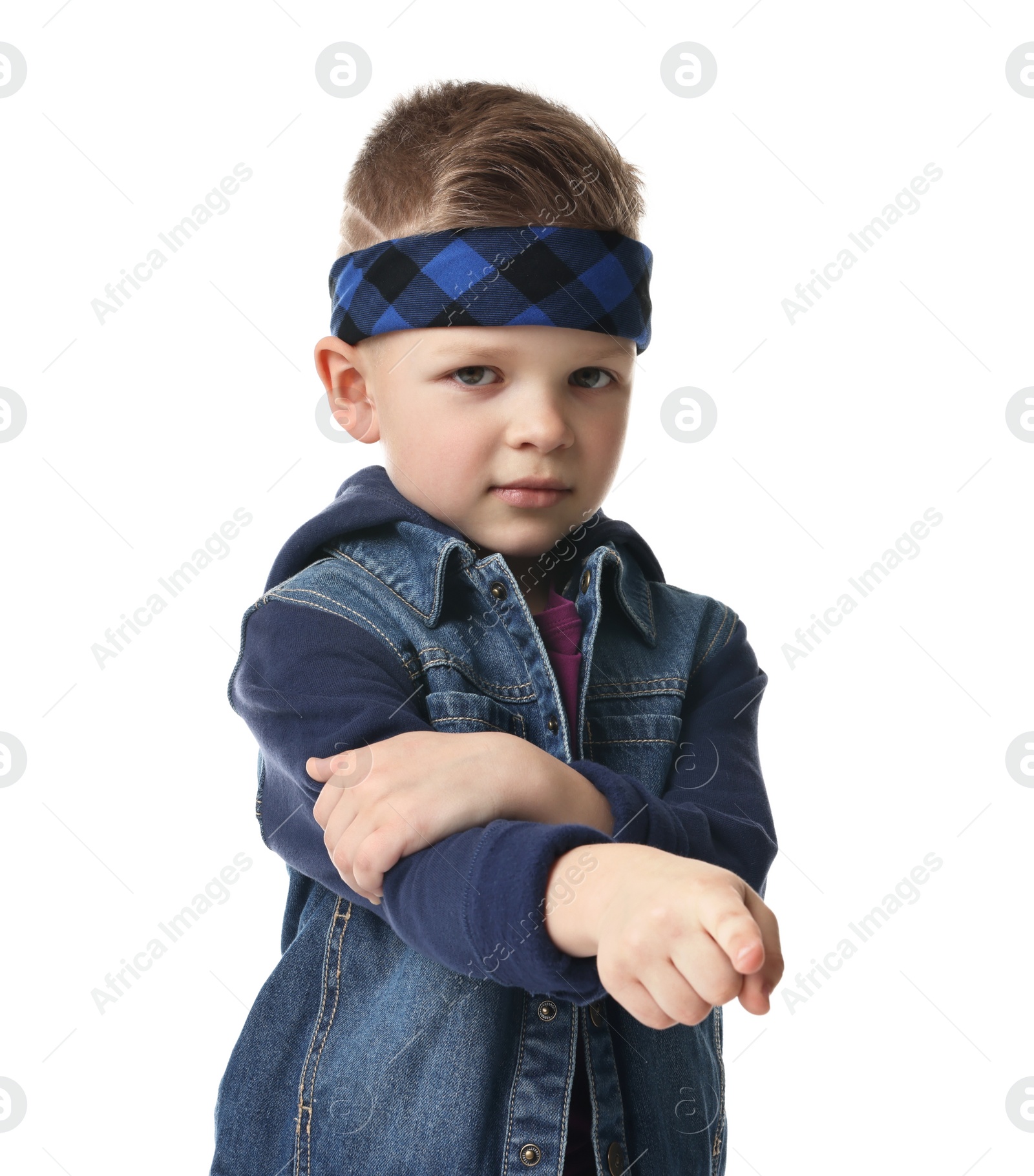 Photo of Happy little boy pointing at something on white background