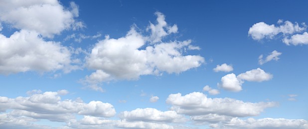 Picturesque view of beautiful blue sky with fluffy clouds on sunny day, banner design