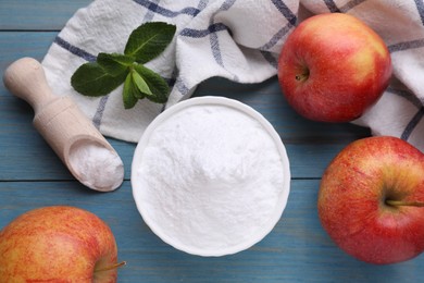 Photo of Sweet fructose powder, mint leaves and apples on light blue wooden table, flat lay