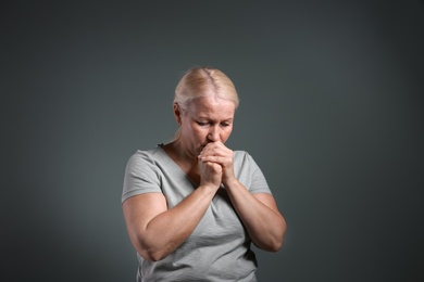 Photo of Mature woman suffering from depression on grey background
