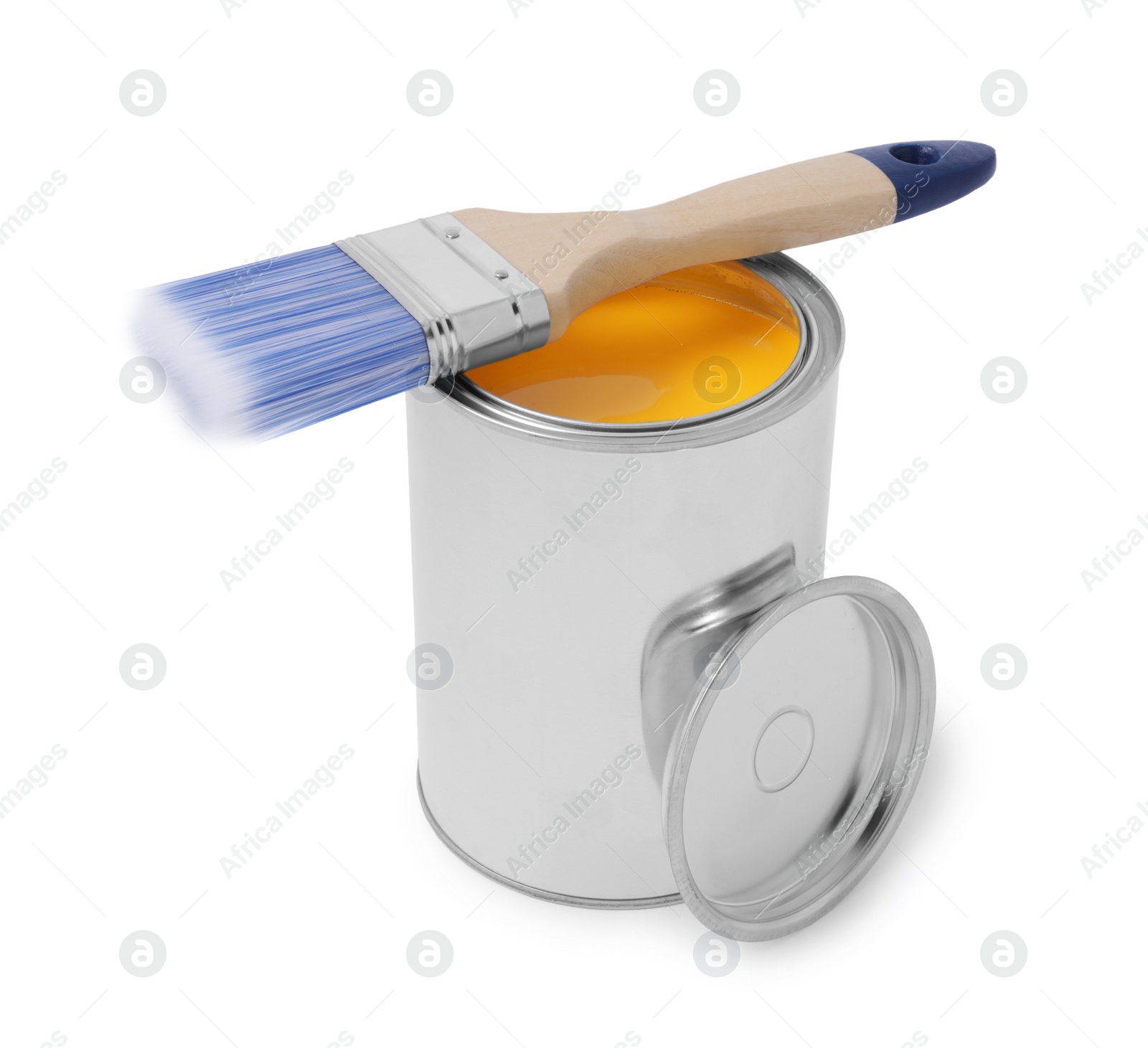 Photo of Can with yellow paint and brush on white background