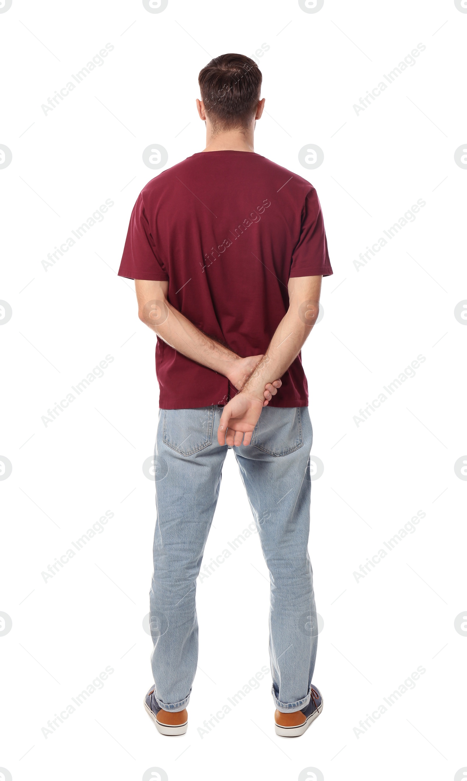Photo of Young man in casual clothes posing on white background