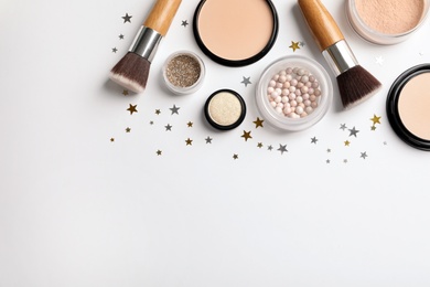 Photo of Flat lay composition with makeup products and Christmas decor on white background. Space for text