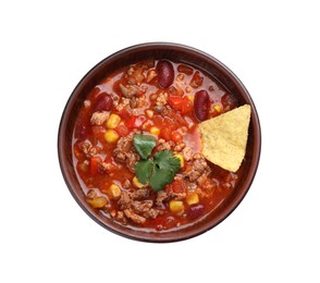 Bowl of tasty chili con carne with nachos on white background, top view