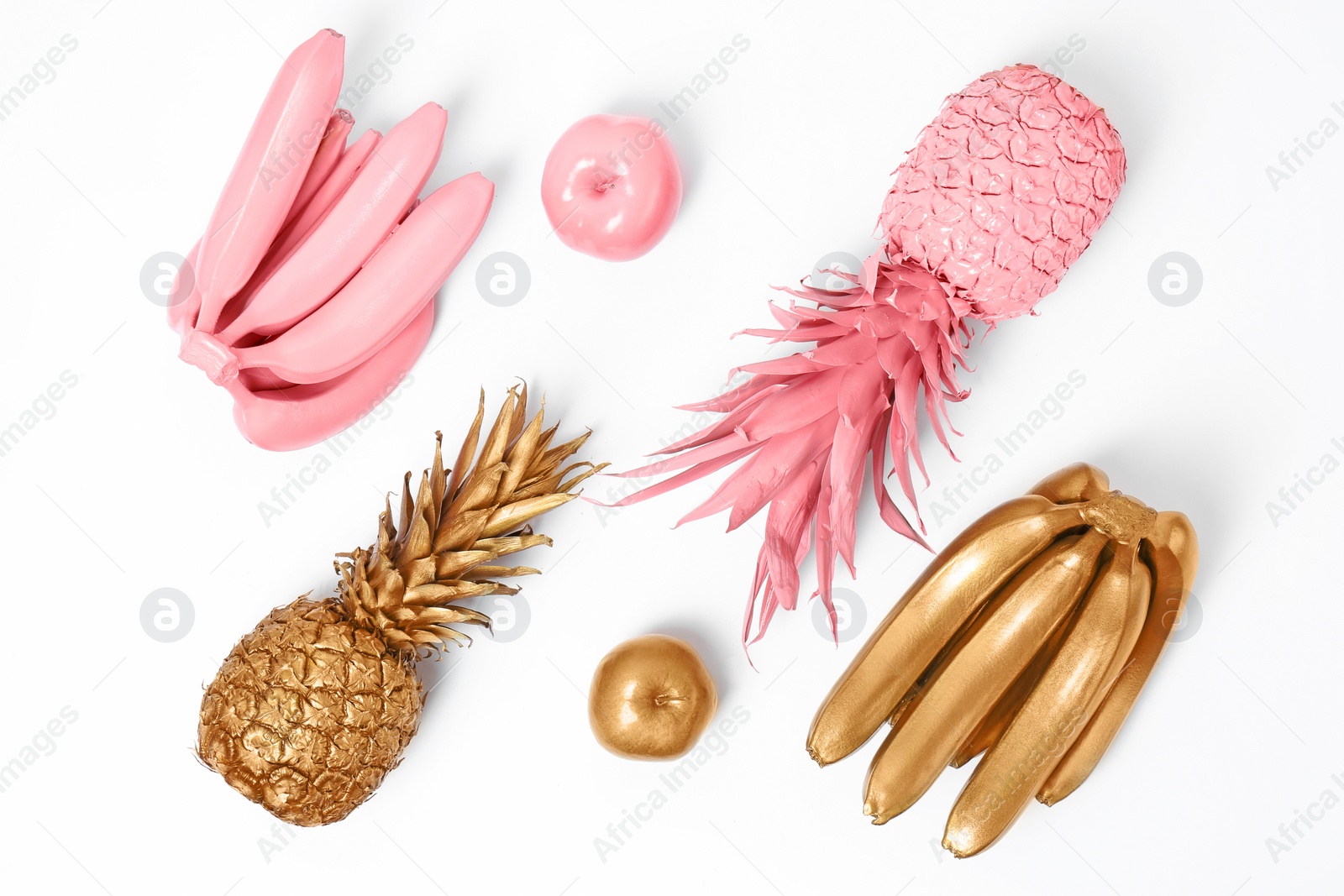 Photo of Composition with gold and pink fruits on white background, top view